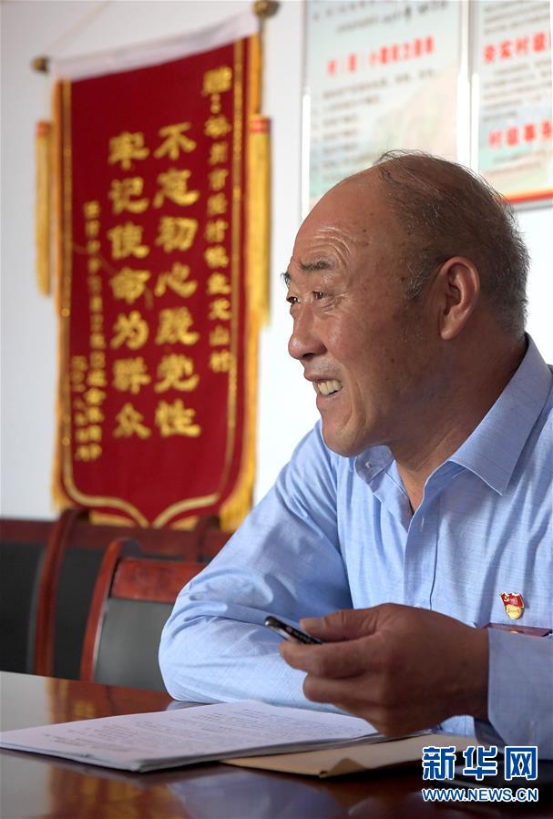 （图片故事）（2）“独臂村支书”的美丽山村梦